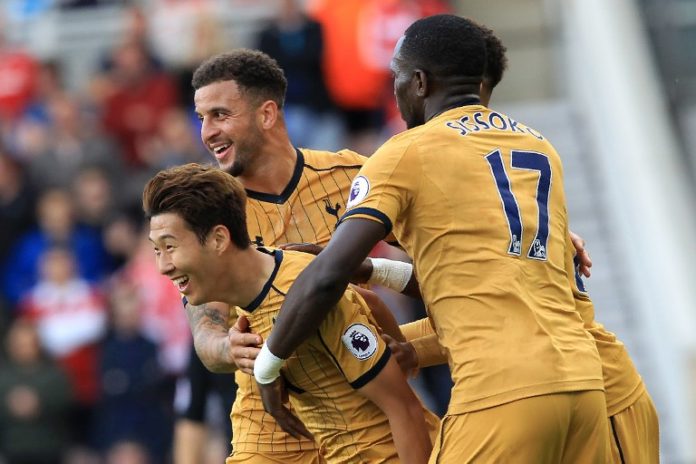 Tottenham Hotspur's South Korean striker Son Heung-Min (L) celebrates scoring his team's first goal during the English Premier League football match between Middlesbrough and Tottenham Hotspur at Riverside Stadium in Middlesbrough, northeast England on September 24, 2016. / AFP PHOTO / Lindsey PARNABY / RESTRICTED TO EDITORIAL USE. No use with unauthorized audio, video, data, fixture lists, club/league logos or 'live' services. Online in-match use limited to 75 images, no video emulation. No use in betting, games or single club/league/player publications. /