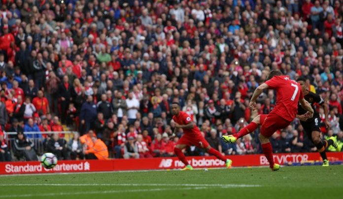 Liverpool's English midfielder James Milner shoots from the penalty spot to score his team's fifth goal during the English Premier League football match between Liverpool and Hull City at Anfield in Liverpool, north west England on September 24, 2016. / AFP PHOTO / Geoff CADDICK / RESTRICTED TO EDITORIAL USE. No use with unauthorized audio, video, data, fixture lists, club/league logos or 'live' services. Online in-match use limited to 75 images, no video emulation. No use in betting, games or single club/league/player publications. /