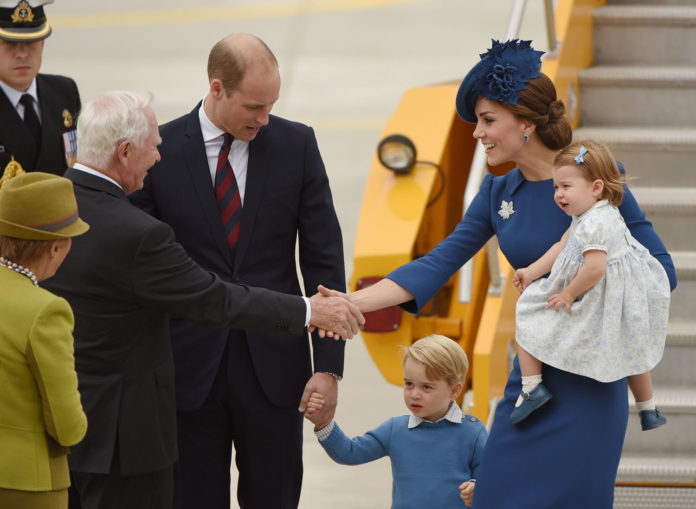 Prince William (C), Duke of Cambridge, Prince George of Cambridge (3R), Catherine, Duchess of Cambridge (2R) and Princess Charlotte of Cambridge (R) are greeted by David Johnston, Governor General of Canada,(2L) and Sharon Johnston, after they arrived at 443 Maritime Helicopter Squadron on September 24, 2016, in Victoria, British Columbia. The prince and his wife first visited Canada five years ago. This time they will take in the natural beauty of Canada's Pacific coast, heading as far north as the rugged Yukon territory, and will also meet with indigenous people. / AFP PHOTO / Don MacKinnon