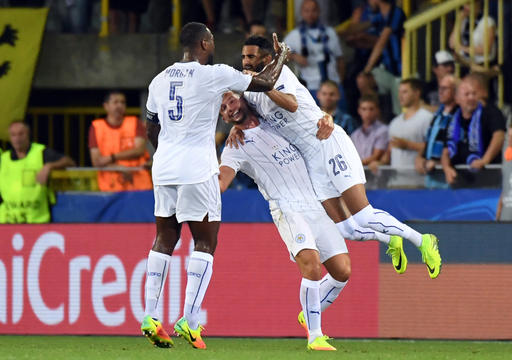 Leicester's Riyad Mahrez, right, celebrates with teammates after scoring during the Champions League Group G soccer match between Club Brugge and Leicester at the Jan Breydel stadium in Brugge, Belgium on Wednesday, Sept. 14, 2016. (AP Photo/Geert Vanden Wijngaert)