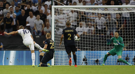 Tottenham's Harry Kane, left, tries a shot on goal during the Champions League Group E soccer match between Tottenham Hotspur and Monaco at Wembley stadium in London Wednesday, Sept. 14, 2016. (AP Photo/Frank Augstein)