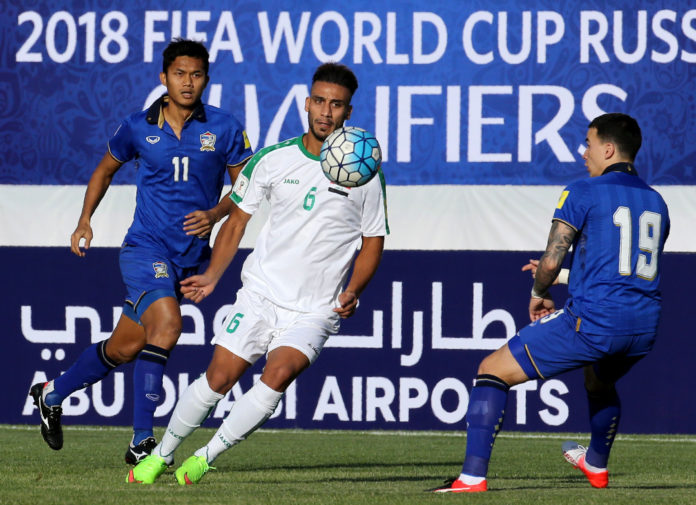 Iraq's Ali Adnan Kadhim (L) vies for the ball with Thailand's Chanathip Songkrasin (R)during their 2018 World Cup qualifying football match at Shahid Dastgerdi Stadium in the Iranian capital Tehran, on October 11, 2016. / AFP PHOTO / STRINGER