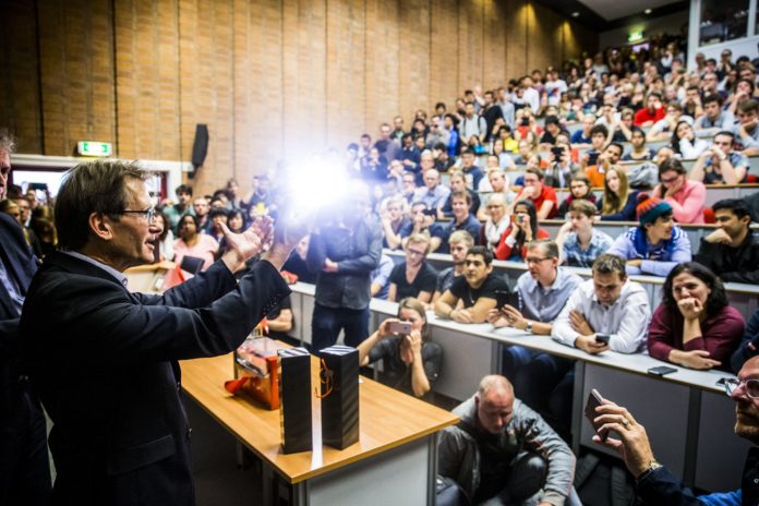 Dutch professor Bernard Feringa gestures at the Rijksuniversiteit of Groningen on October 5, 2016 after winning the 2016 Nobel Chemistry Prize. A trio of French, British and Dutch scientists won the Nobel Chemistry Prize on October 5, 2016 for developing molecular machines, the world's smallest machines that may one day act as artificial muscles to power tiny robots or even prosthetic limbs. Jean-Pierre Sauvage of France, J Fraser Stoddart of Britain and Bernard Feringa of the Netherlands "have developed molecules with controllable movements, which can perform a task when energy is added," the jury said. Feringa, a 65-year-old professor at the University of Groningen, told reporters at the Nobel press conference that the prizewinning research offered great opportunities for the future. / AFP PHOTO / ANP / Siese Veenstra / Netherlands OUT