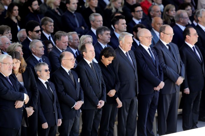 French Interior Minister Bernard Cazeneuve (4thL), French Justice Minister Jean-Jacques Urvoas (5thL), French Education Minister Najat Vallaud-Belkacem (6thL), French Foreign Affairs Minister Jean-Marc Ayrault (4thR), Prince Albert II of Monaco (2ndR), and French President Francois Holande (R) attend a national tribute on October 15, 2016 in Nice, southeastern France in memory of the victims of the July 14 terror attack in which a truck ploughed into crowds celebrating Bastille Day, killing 86 people and injuring more than 400. In the attack, a 31-year-old Tunisian extremist rammed a 19-ton truck through a crowd of more than 30,000 Bastille Day revellers on the seafront Promenade des Anglais before police shot him dead. The Islamic State (IS) group said the driver of the truck, Mohamed Lahouaiej Bouhlel, was one of its followers. / AFP PHOTO / VALERY HACHE