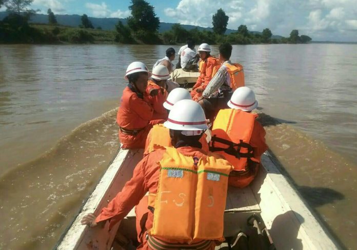 In this handout photograph released by the Myanmar Fire Services Department on October 17, 2016, government rescue personnel from the Myanmar Fire Services Deparment take part in a search operation on the Chindwin River after a ferry capsized near Monywa city in Sagaing region. Searchers have recovered 25 bodies from a ferry that sank in central Myanmar and expect to find scores more corpses as workers begin raising the boat from the riverbed, officials said on October 17. A total of 154 people have been rescued since the boat sank early on October 15 on the Chindwin River about 72 kilometres (45 miles) north of the city of Monywa.  / AFP PHOTO / MYANMAR FIRE SERVICES DEPARTMENT / STR / RESTRICTED TO EDITORIAL USE - MANDATORY CREDIT "AFP PHOTO /  MYANMAR FIRE SERVICES DEPARTMENT " - NO MARKETING NO ADVERTISING CAMPAIGNS - DISTRIBUTED AS A SERVICE TO CLIENTS
