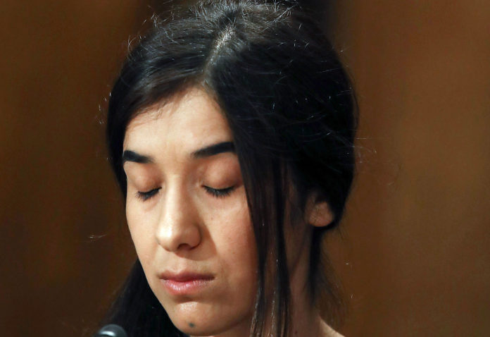 (FILES) This file photo taken on June 21, 2016 shows Nadia Murad, human rights activist, testifying during Senate Homeland Security and Governmental Affairs Committee hearing on Capitol Hill, in Washington, DC. Two Yazidi women activists who escaped the Islamic State group in Iraq have been awarded the European Parliament's prestigious Sakharov human rights prize for this year on October 27, 2016, European sources told AFP. The prize will go to Nadia Murad and Lamia Haji Bashar -- who campaign to protect their Yazidi people and were enslaved by IS -- during a midday session of the assembly in Strasbourg, France, the sources told AFP. / AFP PHOTO / GETTY IMAGES NORTH AMERICA / MARK WILSON