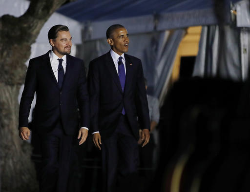 President Barack Obama and actor Leonardo DiCaprio walk to the stage to talk about climate change as part of the White House South by South Lawn event on the South Lawn of the White House in Washington,Monday, Oct. 3, 2016. (AP Photo/Carolyn Kaster)