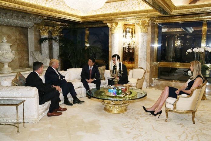 This handout picture from Japan's Cabinet Secretariat released on November 18, 2016 shows Japan's Prime Minister Shinzo Abe (3rd L) meeting with US President-elect Donald Trump (2nd L) in New York, as Trump's daughter Ivanka Trump (R) looks on. Ivanka Trump, the daughter of US President-elect Donald Trump was present at his meeting with Japan's prime minister, underscoring the influence of family members as the real-estate mogul prepares to take the reins of the world's sole superpower. / AFP PHOTO / Cabinet Secretariat / STR / HANDOUT RESTRICTED TO EDITORIAL USE - MANDATORY CREDIT "AFP PHOTO / CABINET SECRETARIAT" - NO MARKETING - NO ADVERTISING CAMPAIGNS - DISTRIBUTED AS A SERVICE TO CLIENTS