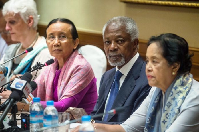 Former UN secretary-general Kofi Annan, head of the nine-member multi-sector advisory commission on Myanmar's Rakhine State, sits with commission members Laetitia Van Den Assum (L), Mya Thidar (2nd L) and Saw Khin Tint (R) during a press conference in Yangon on December 6, 2016. Around 21,000 Rohingya have fled to Bangladesh in recent weeks to escape violence in neighbouring Myanmar, an official of the International Organisation for Migration said on December 6. / AFP PHOTO / ROMEO GACAD