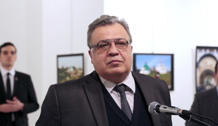 Andrei Karlov, the Russian Ambassador to Turkey, pauses during a speech at a photo exhibition in Ankara on Monday, Dec. 19, 2016, moments before a gunman opened fire on him. Karlov was rushed to a hospital after the attack and later died from his gunshot wounds. (AP Photo/Burhan Ozbilici)