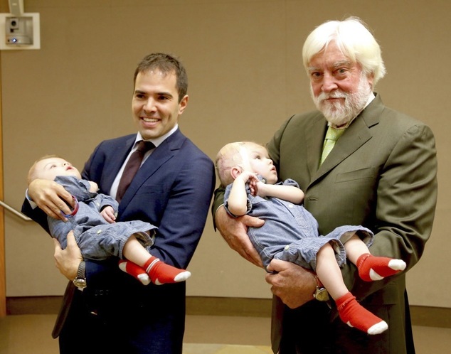This photo provided by Montefiore Hospital shows, from left, Dr. Oren Tepper and  Dr.  James Goodrich holding a pair of formerly conjoined twins, Jadon, left and Anias in New York.  Jadon and Anias were separated in a 20-hour procedure at New York City’s Montefiore Medical Center on Oct. 13 and 14, 2016. The hospital says they have been transferred to Blythedale Children's Hospital in suburban Westchester, where they will receive specialized rehabilitation care.  (Montefiore Hospital via AP)