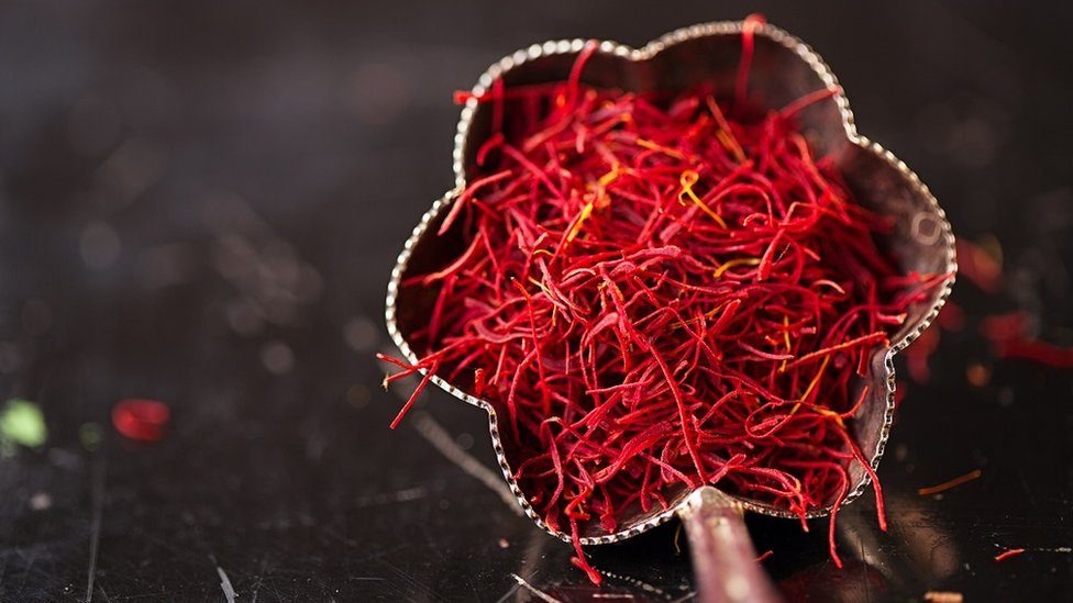 Saffron spice threads in vintage silver bowl