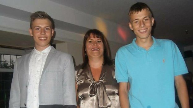 Alex with his mother and twin brother