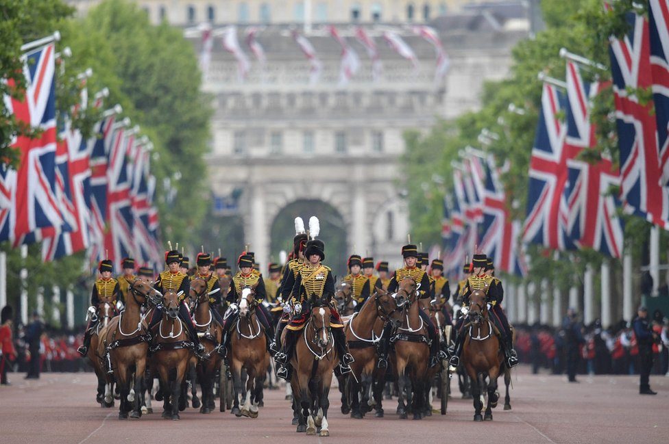 Members of The Kings Troop Royal Artillery lead the parade down the Mall back to Buckingham Palace after of the Queens Birthday Parade, Trooping the Colour