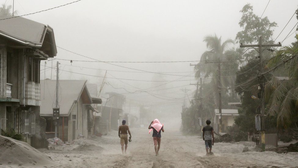 Residents living near the errupting Taal Volcano evacuate in Agoncillo, Batangas City