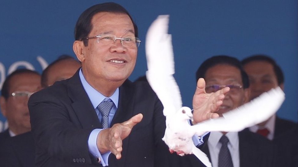 Cambodian Prime Minister Hun Sen (R) releases a dove during the Victory Day parade in Phnom Penh, Cambodia, 07 January 2020