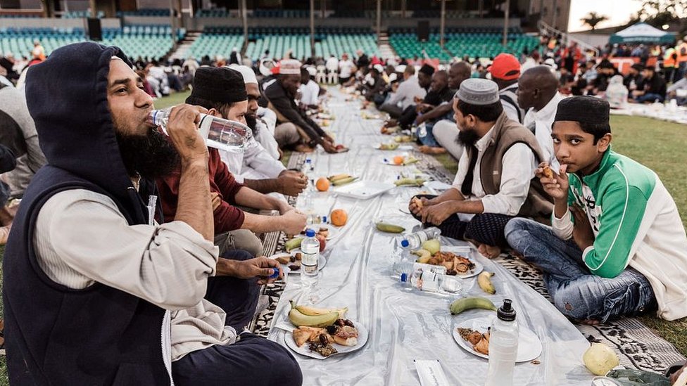 Muslims breaking Ramadan fast with ceremonial meal