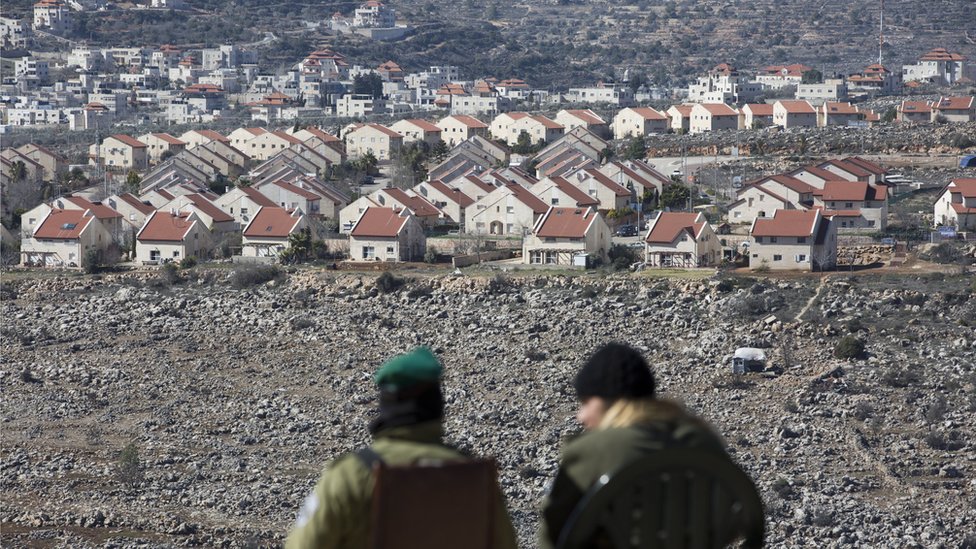Israeli border police guard the Israeli settlement of Ofra, in the West Bank, on 7 February 2017
