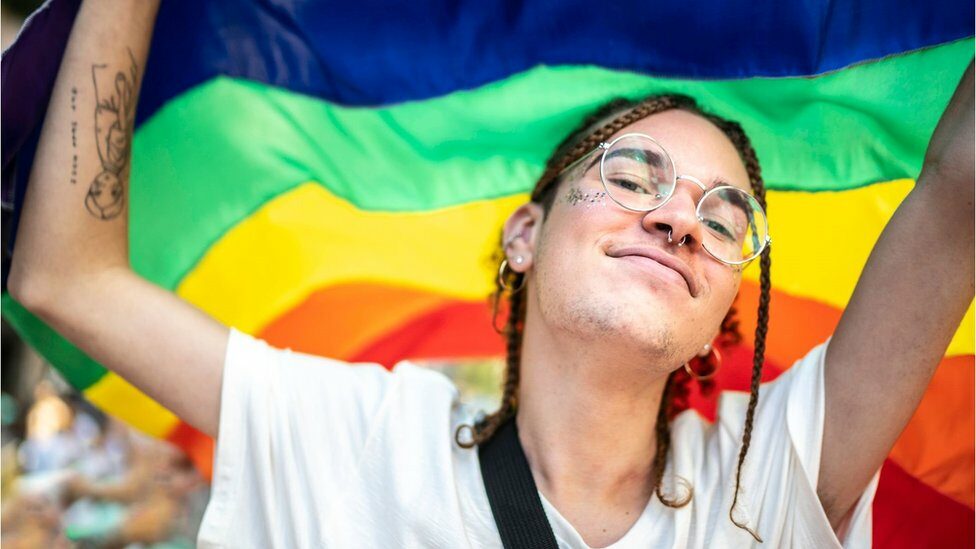 Gen-z youngster with the pride flag