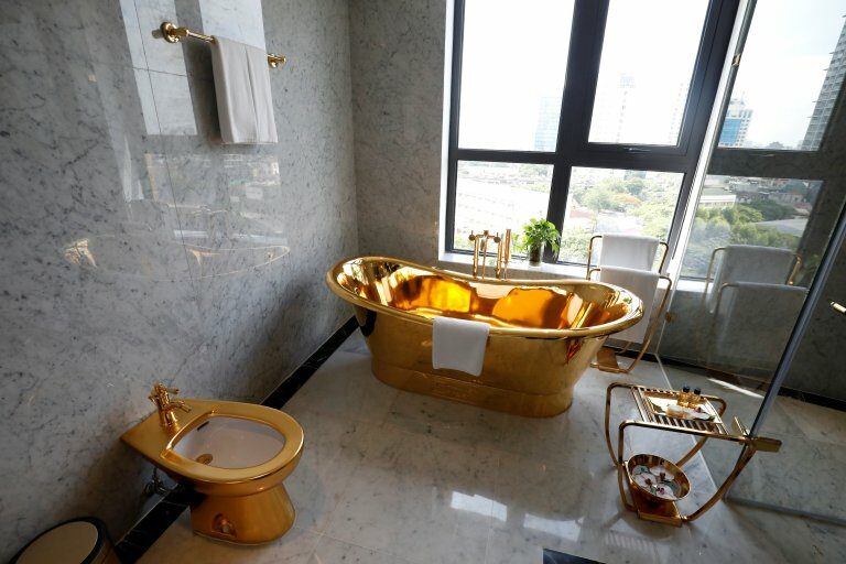 A gold plated bathtub and a gold plated toilet are seen in the newly-inaugurated Dolce Hanoi Golden Lake luxury hotel, after the government eased a nationwide lockdown following the global outbreak of the coronavirus disease (COVID-19), in Hanoi