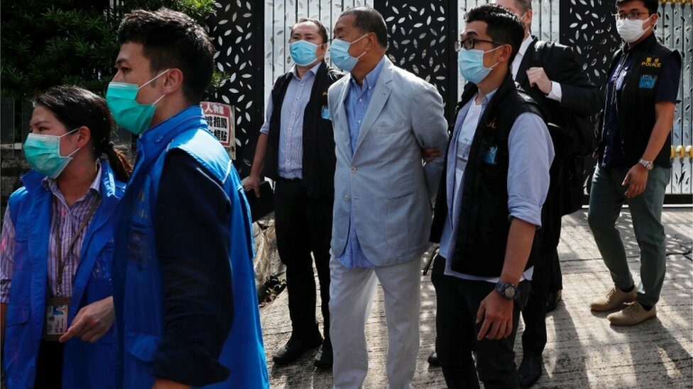Jimmy Lai being detained by the national security unit