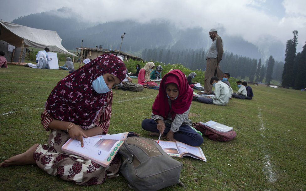 Two girls during class in Indian-administered Kashmir