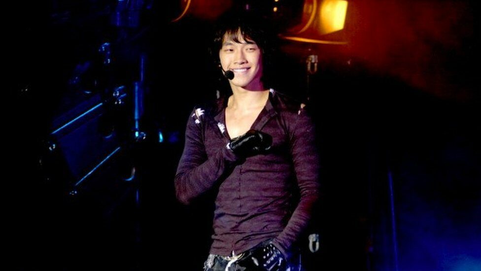 Rain on stage smiling