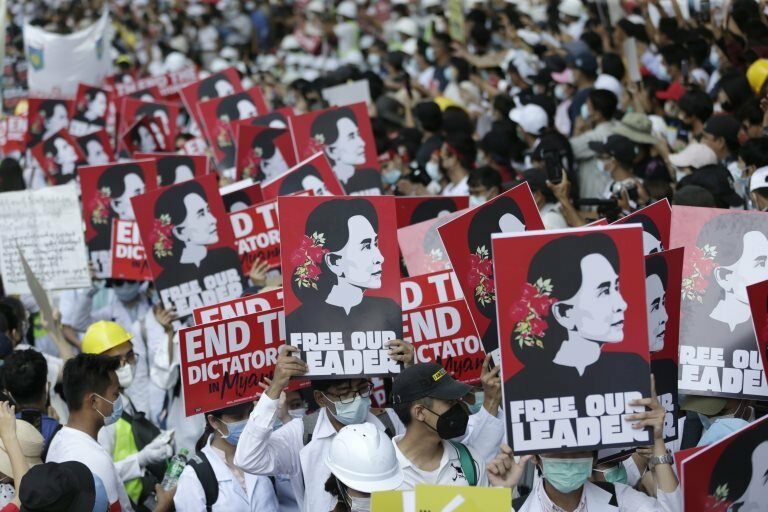 Demonstrators hold placards calling for the release of detained civilian leader Aung San Suu Kyi during a protest against the military coup, in Yangon, Myanmar, 25 February 2021