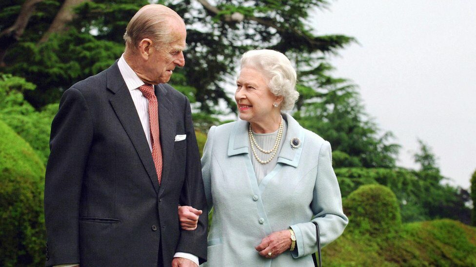Prince Phillip, the Duke of Edinburgh, and Queen Elizabeth II arm in arm