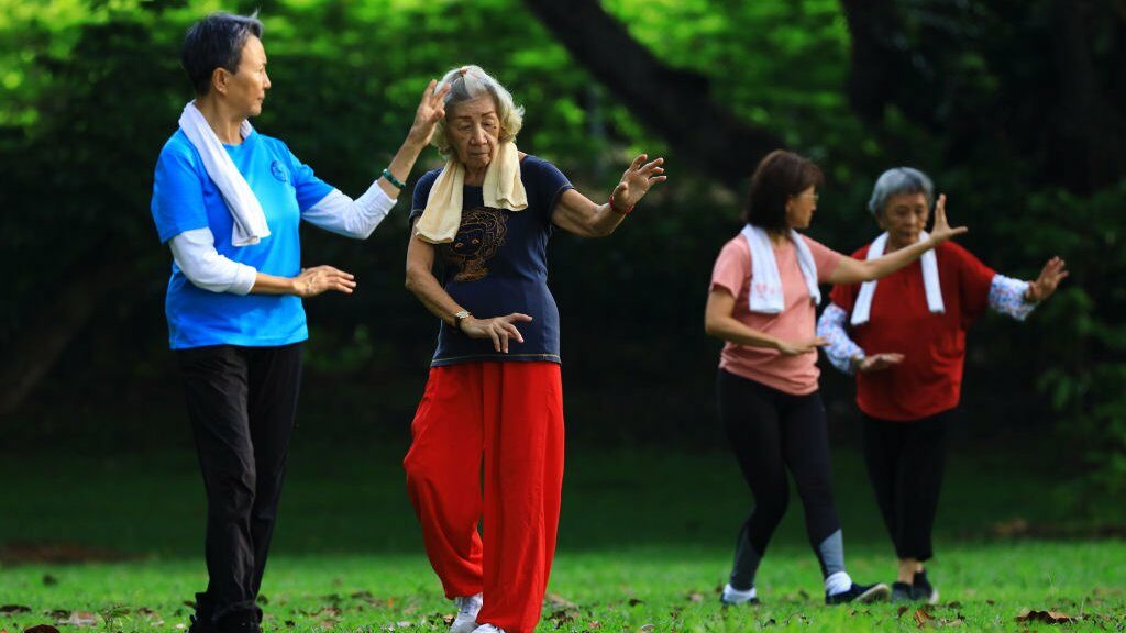 People exercise at a park on 10 April 2021 in Singapore