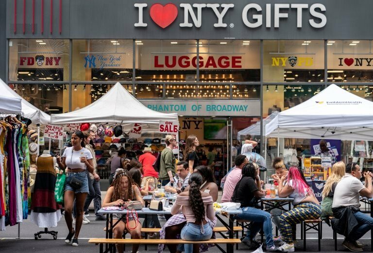 People shop at a street fair near Times Square in New York City