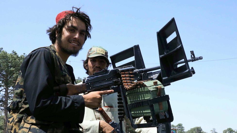 Taliban forces patrol a street in Herat, Afghanistan