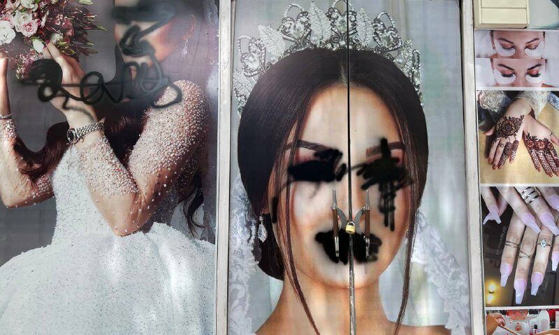 A poster of a bride with her eyes and mouth painted over
