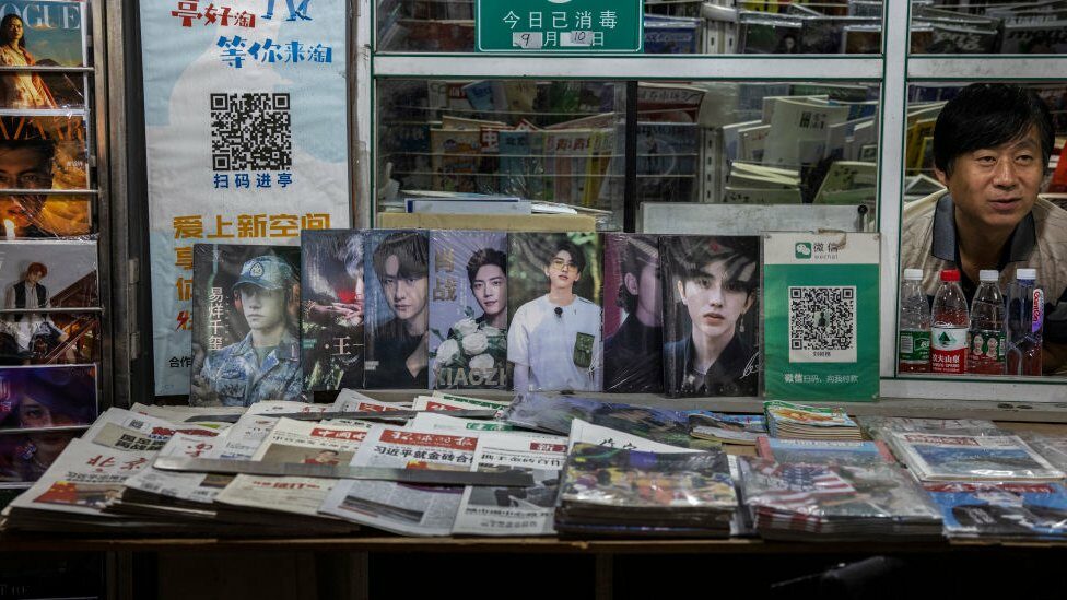 Celebrity magazines are seen on display at a newsstand in Beijing