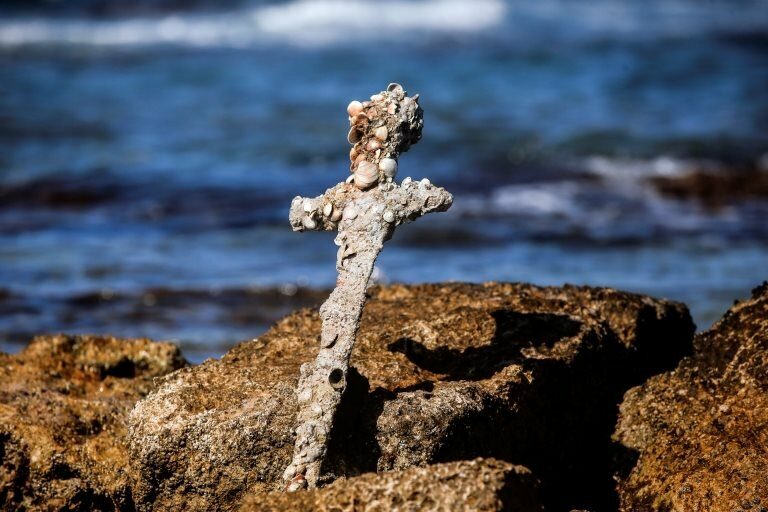 A sword believed to have belonged to a Crusader who sailed to the Holy Land almost a millennium ago was found in Caesarea