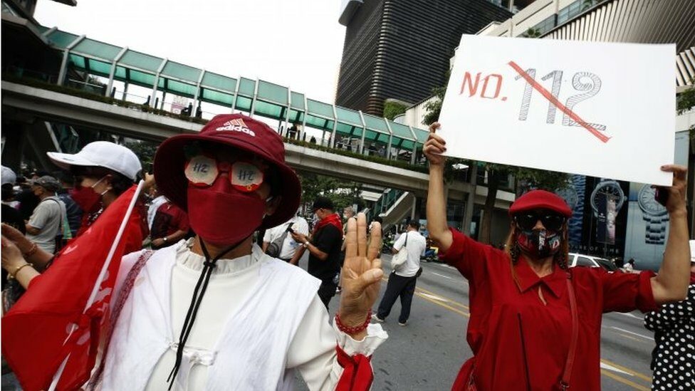 Thai anti-government protesters flashe three-finger salute with a message "No 112" of lese majeste law as they gather to protest against the lese majeste law in Bangkok, Thailand, 31 October 2021