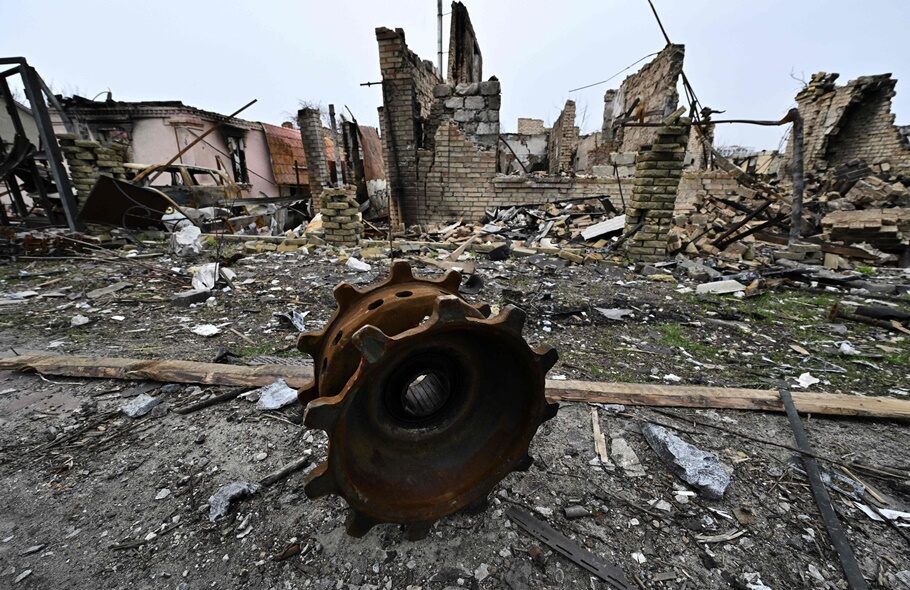 Debris of destroyed armoured vehicles is seen on a street in the town of Bucha.