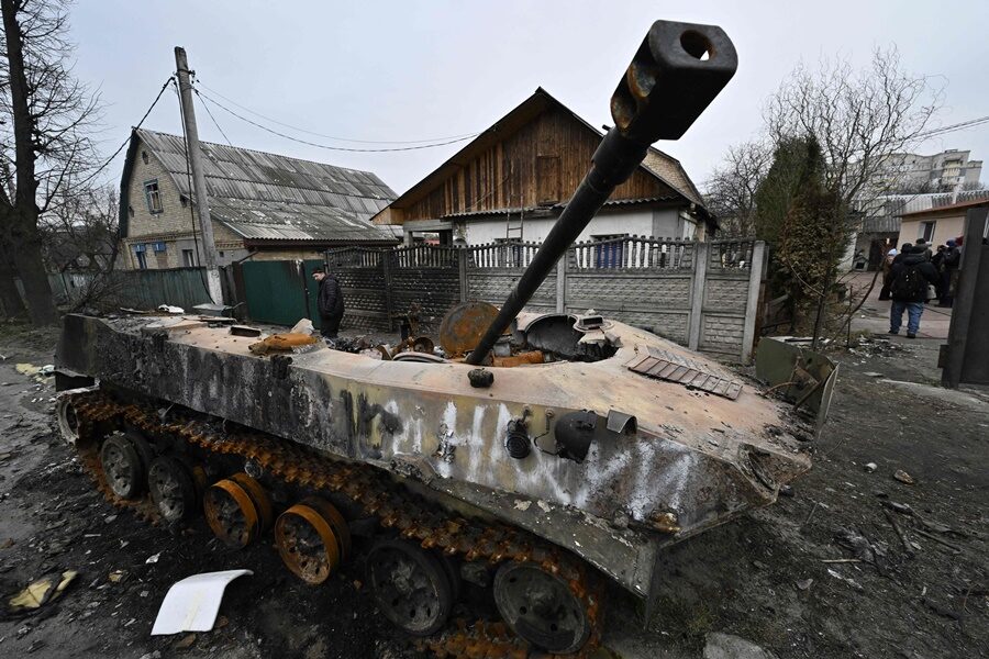 Debris of destroyed armoured vehicles is seen on a street in the town of Bucha.