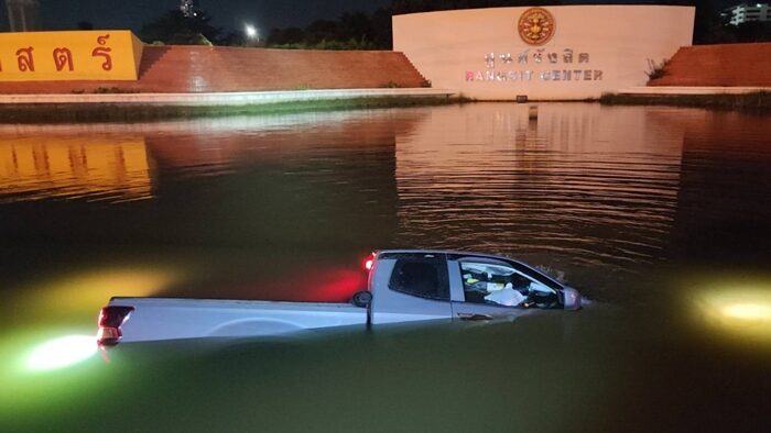 Pickup and sedan plunge into pond after collision near Thammasat | News by Thaiger