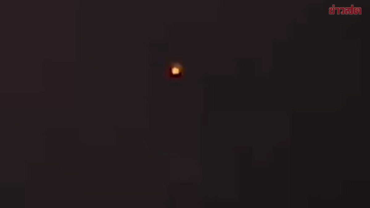 Woman Terrified by Strange Floating Green-Orange Lights on Buddhist Holy Days