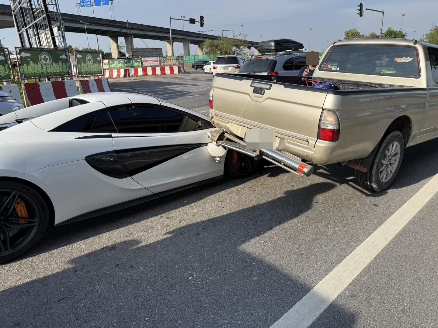 McLaren 570S wedged under pickup truck in Sai Mai crash | News by Thaiger