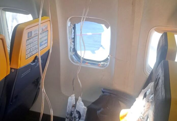 A broken window and the interior of the Ryanair aircraft, following a reported emergency landing, in location given as Thessaloniki, Greece, July 10, 2026, in this picture obtained from social media. Despoina Papapavlou/via REUTERS